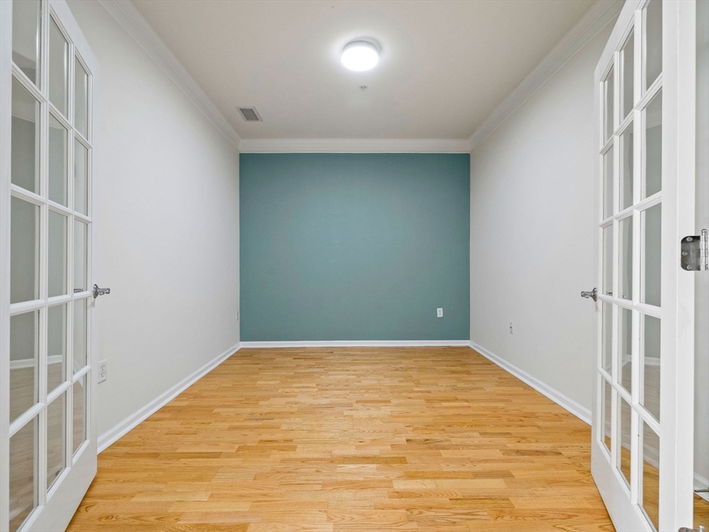 170 Clocktower Drive, Unit 5103 Waltham, MA 02452 - Photo 18 of 29 a view of a big room with wooden floor and windows