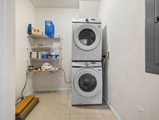 a utility room with sink dryer and washer