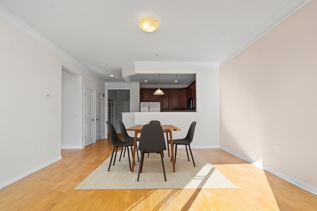 170 Clocktower Drive, Unit 5103 Waltham, MA 02452 - Photo 3 of 29 a view of a dining room with furniture