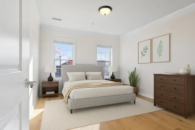 a bedroom with a bed and furniture