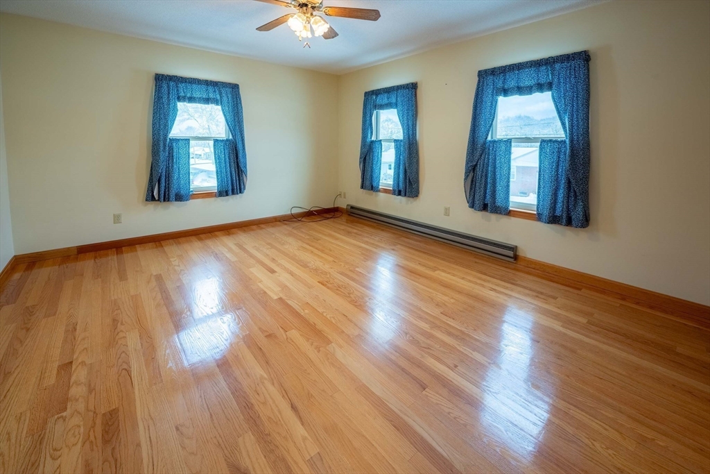 128 Ann Street Chicopee, MA 01020 - Photo 11 of 17 a view of an empty room and window