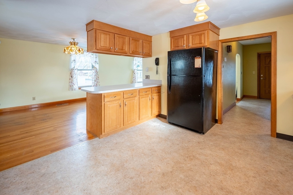 128 Ann Street Chicopee, MA 01020 - Photo 4 of 17 a kitchen with stainless steel appliances a refrigerator and a stove
