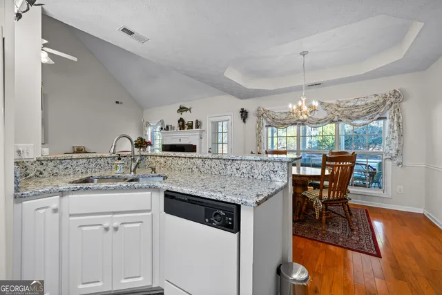 a bed room with a bed and a chandelier