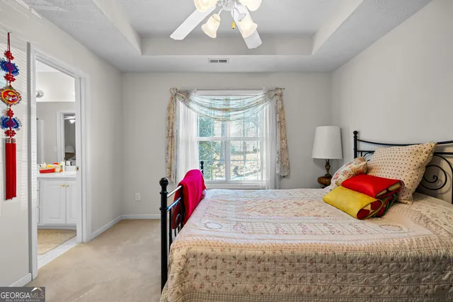 an aerial view of residential house with outdoor space and trees all around