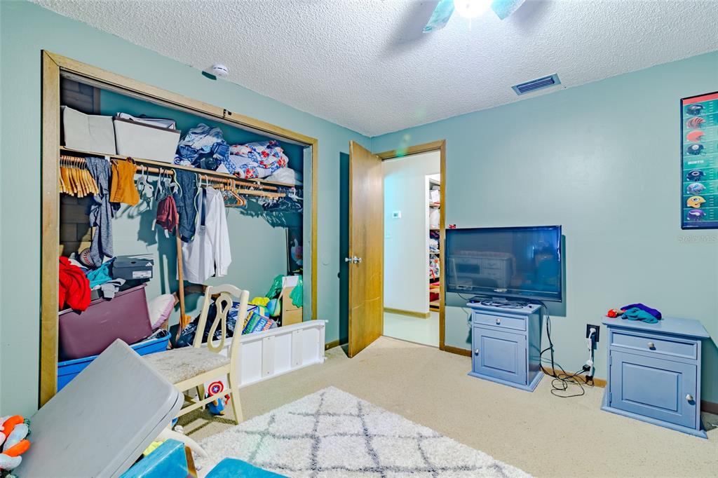 1600 Southwest 42nd Street Ocala, FL 34471 - Photo 14 of 57 a living room with furniture and a flat screen tv