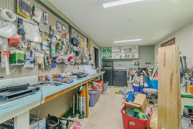 a bed room with a bed and a chandelier