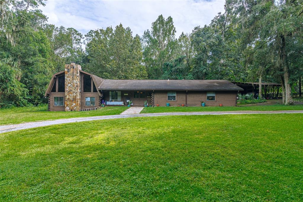 1600 Southwest 42nd Street Ocala, FL 34471 - Photo 23 of 57 a view of a house with a yard and sitting area