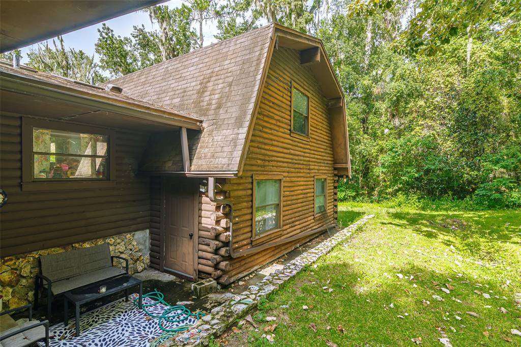 1600 Southwest 42nd Street Ocala, FL 34471 - Photo 25 of 57 a view of a house with a yard