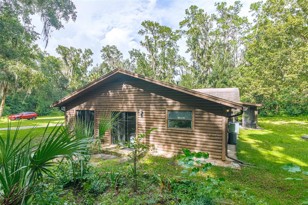 1600 Southwest 42nd Street Ocala, FL 34471 - Photo 26 of 57 a backyard of a house with lots of green space