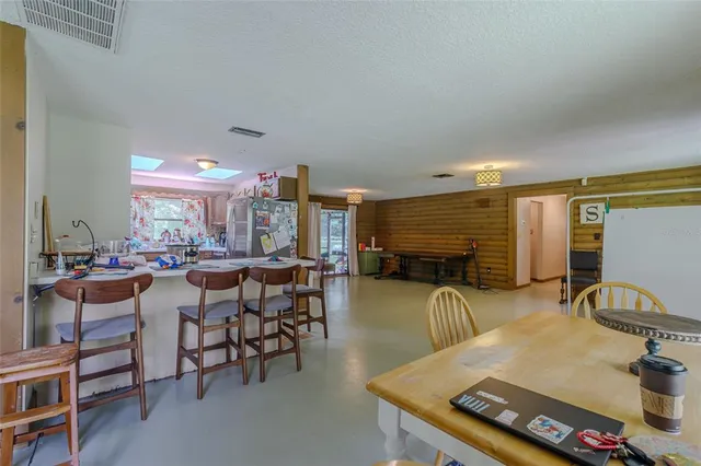a view of a livingroom with furniture and a window