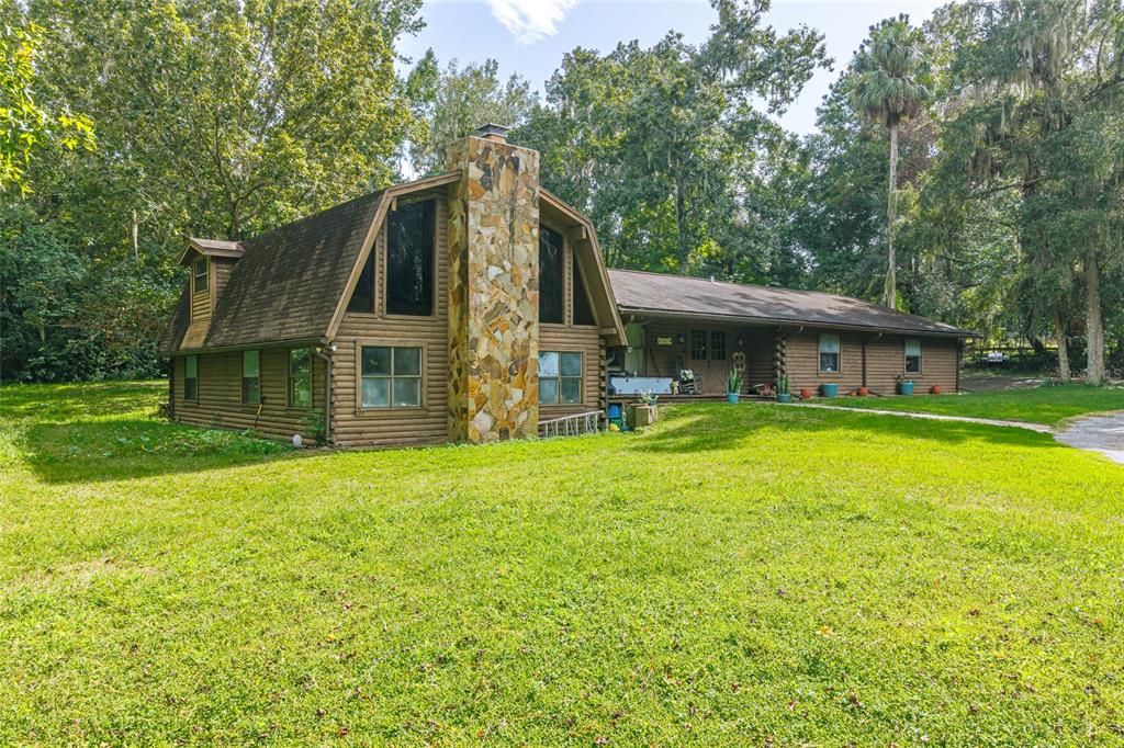 1600 Southwest 42nd Street Ocala, FL 34471 - Photo 3 of 57 a house with swimming pool in front of it