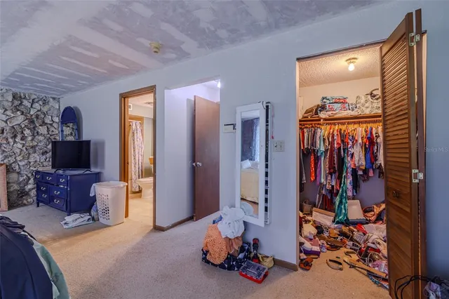 a bedroom with furniture and a table