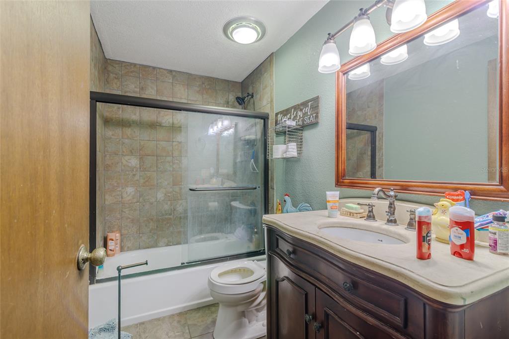 1600 Southwest 42nd Street Ocala, FL 34471 - Photo 40 of 57 a bathroom with a sink toilet and shower