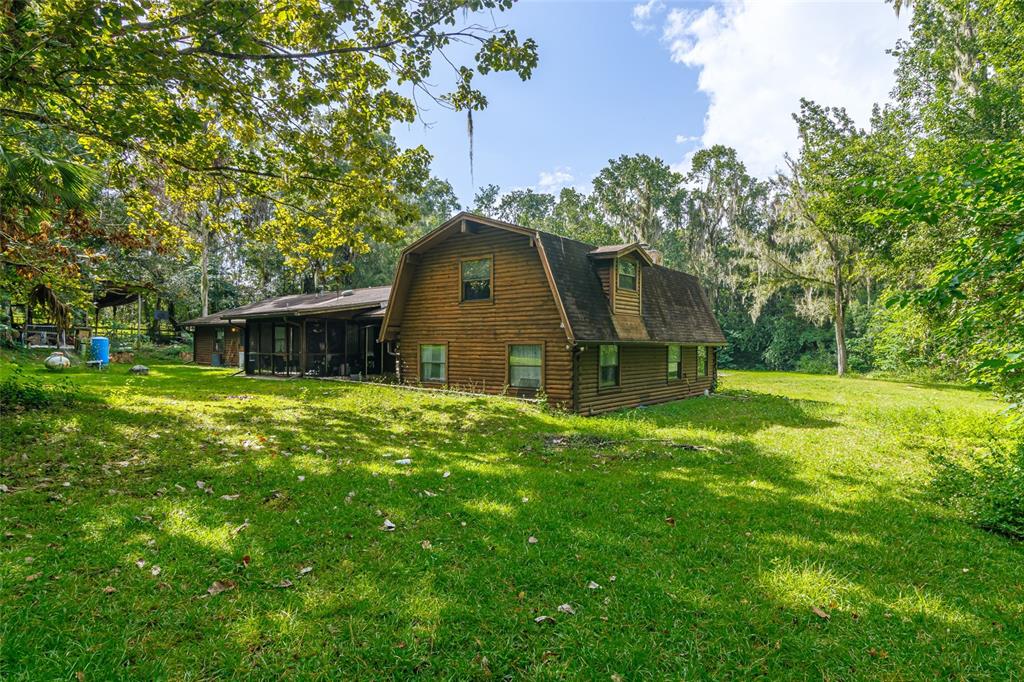 1600 Southwest 42nd Street Ocala, FL 34471 - Photo 4 of 57 a view of a house with backyard and garden