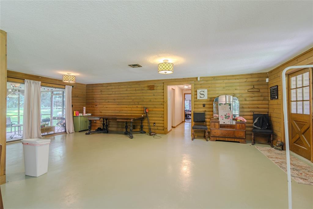 1600 Southwest 42nd Street Ocala, FL 34471 - Photo 45 of 57 a living room with furniture and a large window
