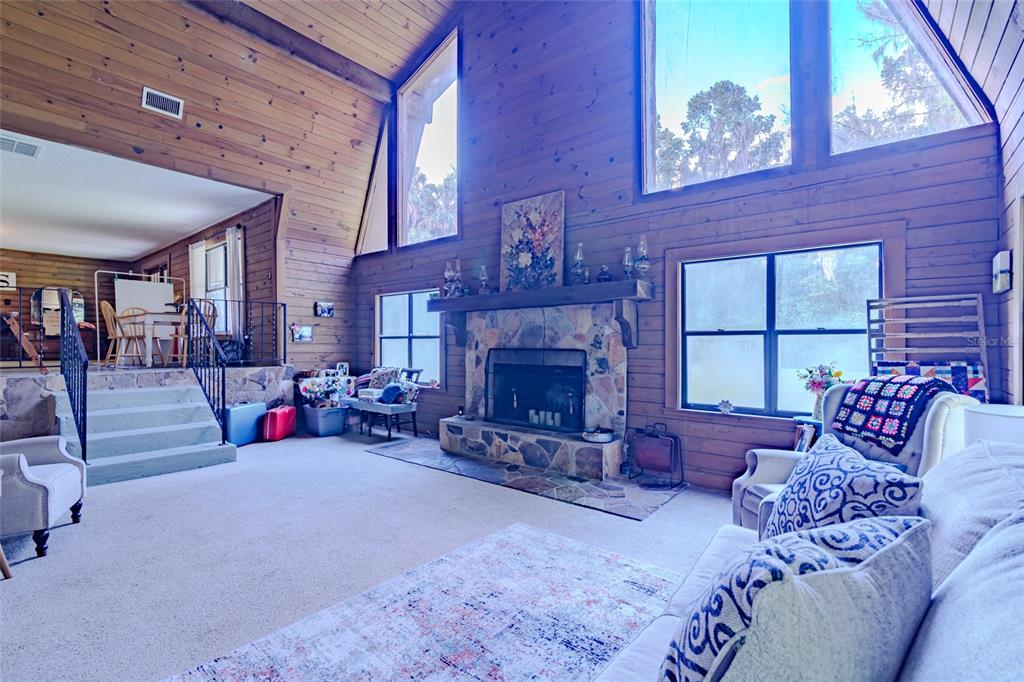 1600 Southwest 42nd Street Ocala, FL 34471 - Photo 55 of 57 a living room with furniture and a fireplace