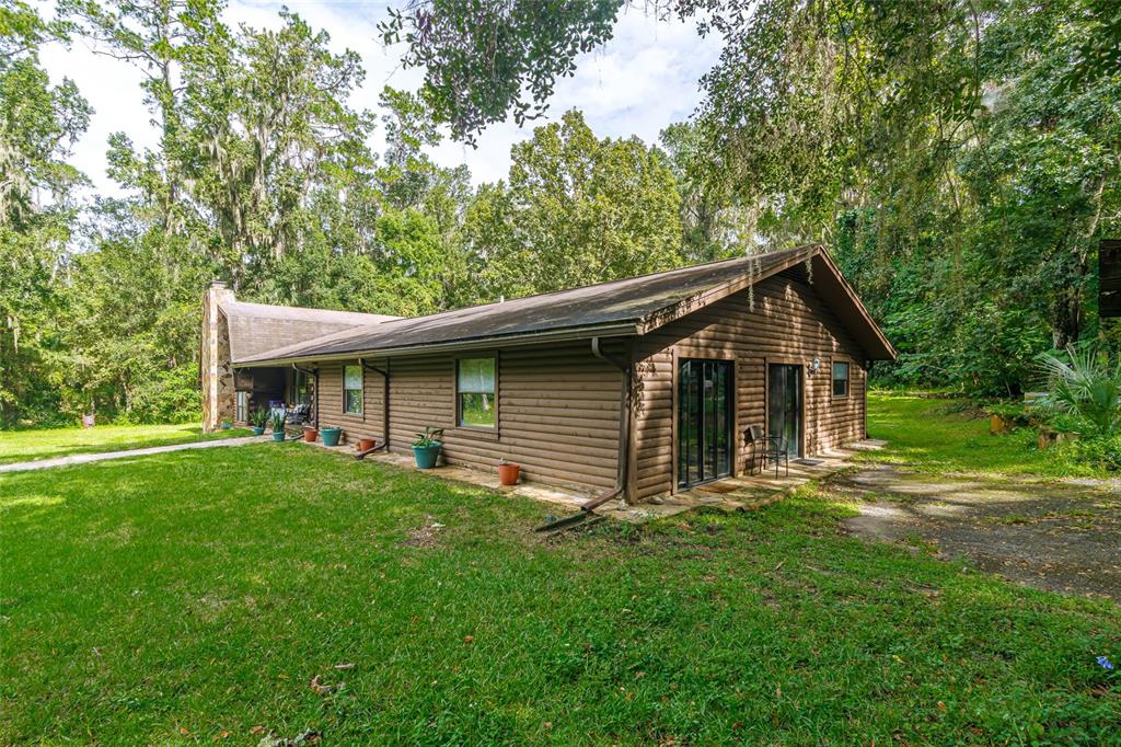 1600 Southwest 42nd Street Ocala, FL 34471 - Photo 6 of 57 a view of a house with a yard