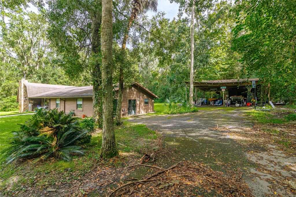 1600 Southwest 42nd Street Ocala, FL 34471 - Photo 7 of 57 a front view of a house with garden