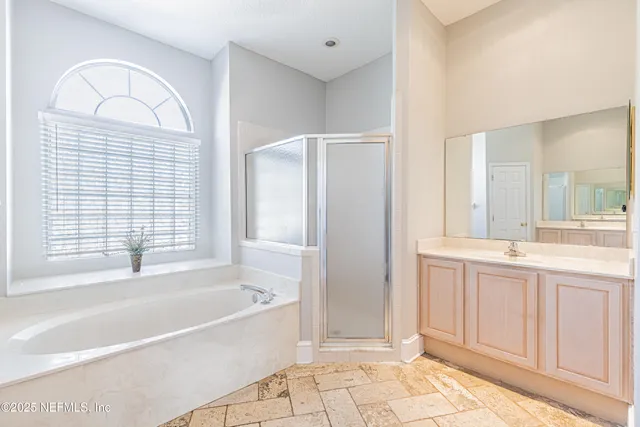 a bathroom with a bathtub and a shower