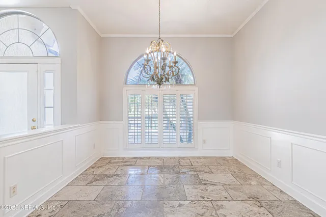 a view of a kitchen with a sink and cabinets