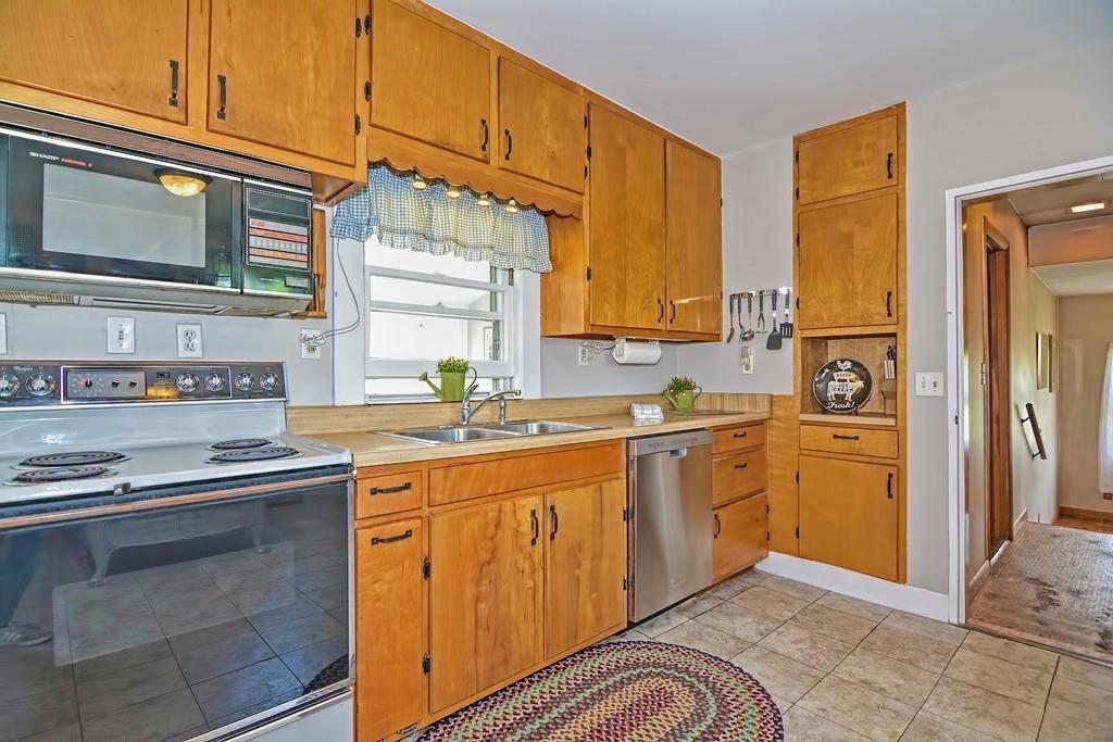 5 Rice Corner Road Brookfield, MA 01506 - Photo 7 of 42 a kitchen with stainless steel appliances granite countertop a stove a sink and a refrigerator