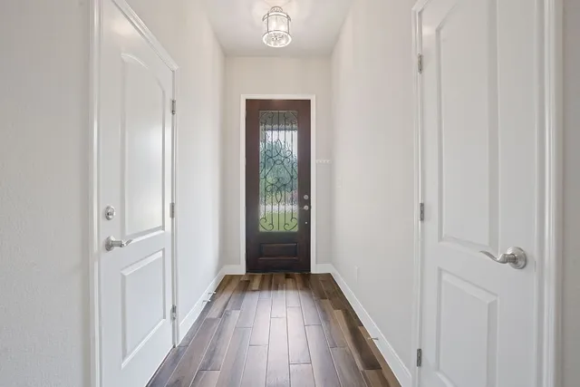 a bathroom with double sink and a mirror