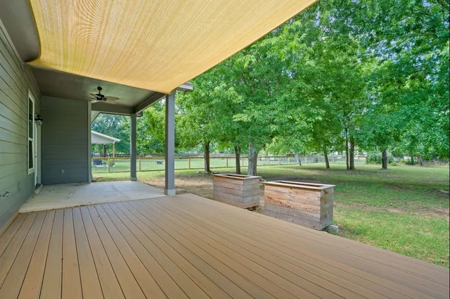 a view of a house with backyard and a backyard
