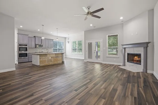 a view of kitchen with cabinets and wooden floor
