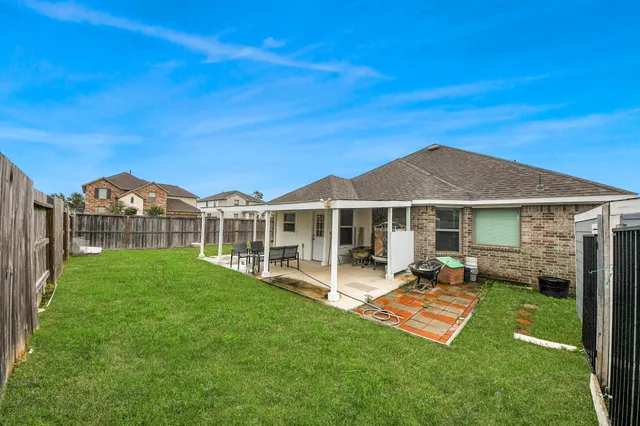 a view of a house with a yard porch and sitting area
