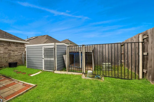 a view of a backyard with a garden
