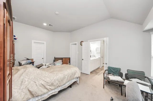 a bedroom with a bed and furniture