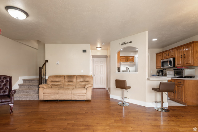 802 Brookside Court Payson, UT 84651 - Photo 8 of 32 Living area with stairs and light wood-style flooring