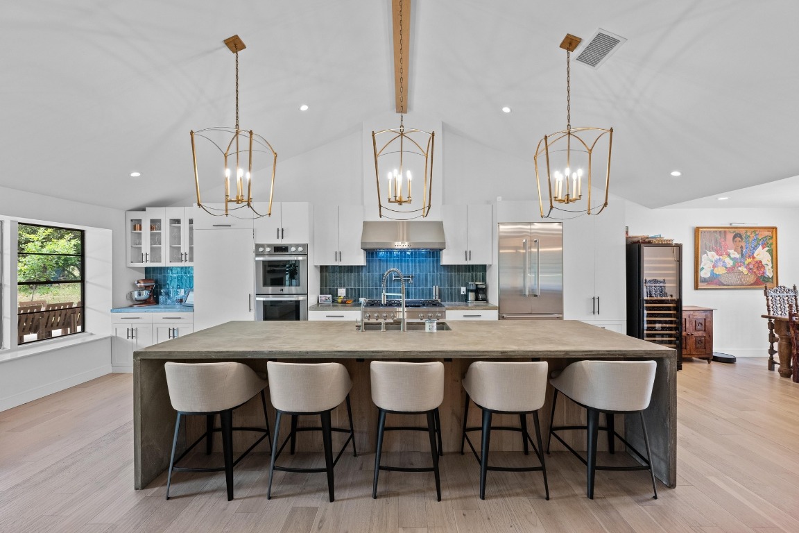 a dining table with chairs and wooden floor
