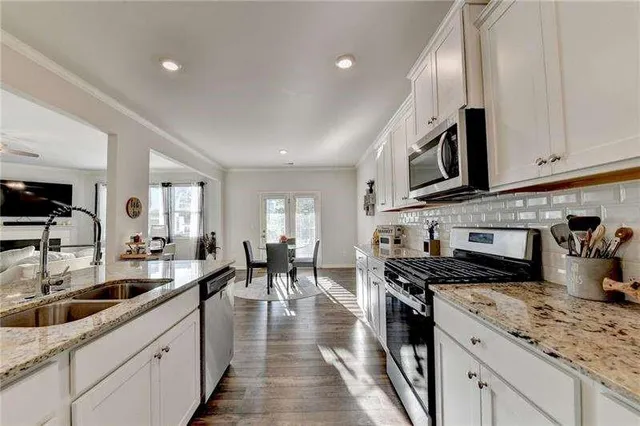 a view of a livingroom with furniture window and wooden floor
