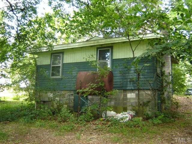 6507 Russell Road Durham, NC 27712 - Photo 2 of 3 a backyard of a house with lots of green space