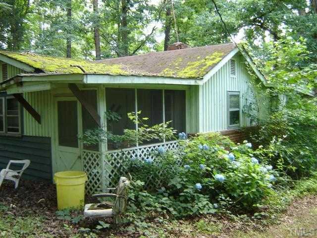 6507 Russell Road Durham, NC 27712 - Photo 3 of 3 a view of a house with garden and plants