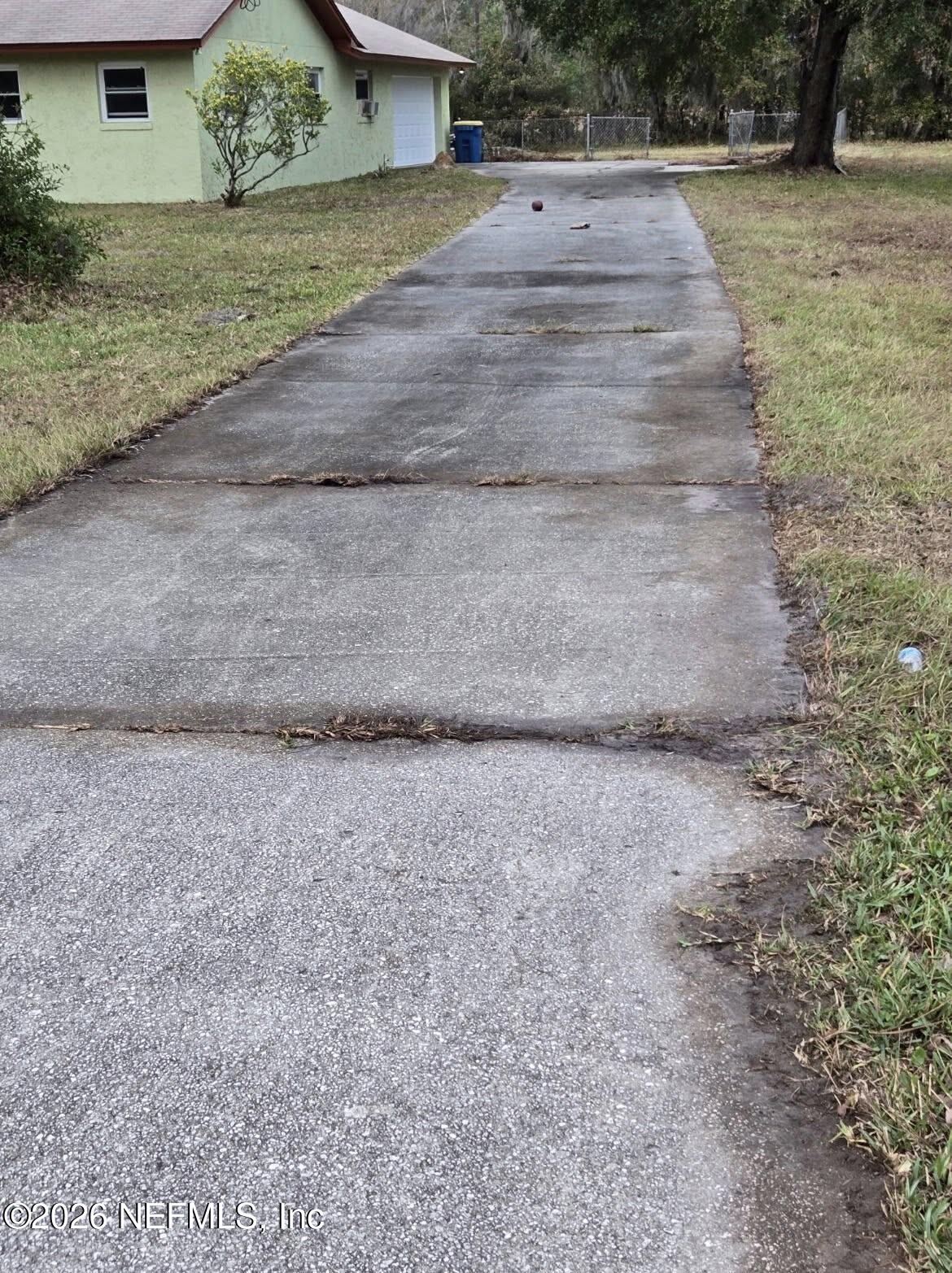943 Noah Road Jacksonville, FL 32218 - Photo 6 of 7 a view of a yard with a house