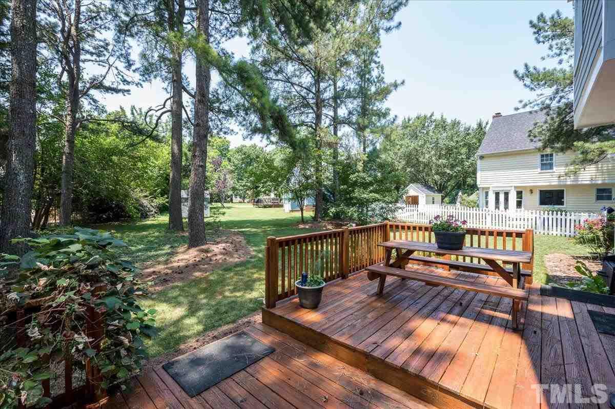 8813 Cottingham Way Raleigh, NC 27615 - Photo 3 of 27 a view of a house with backyard and sitting area