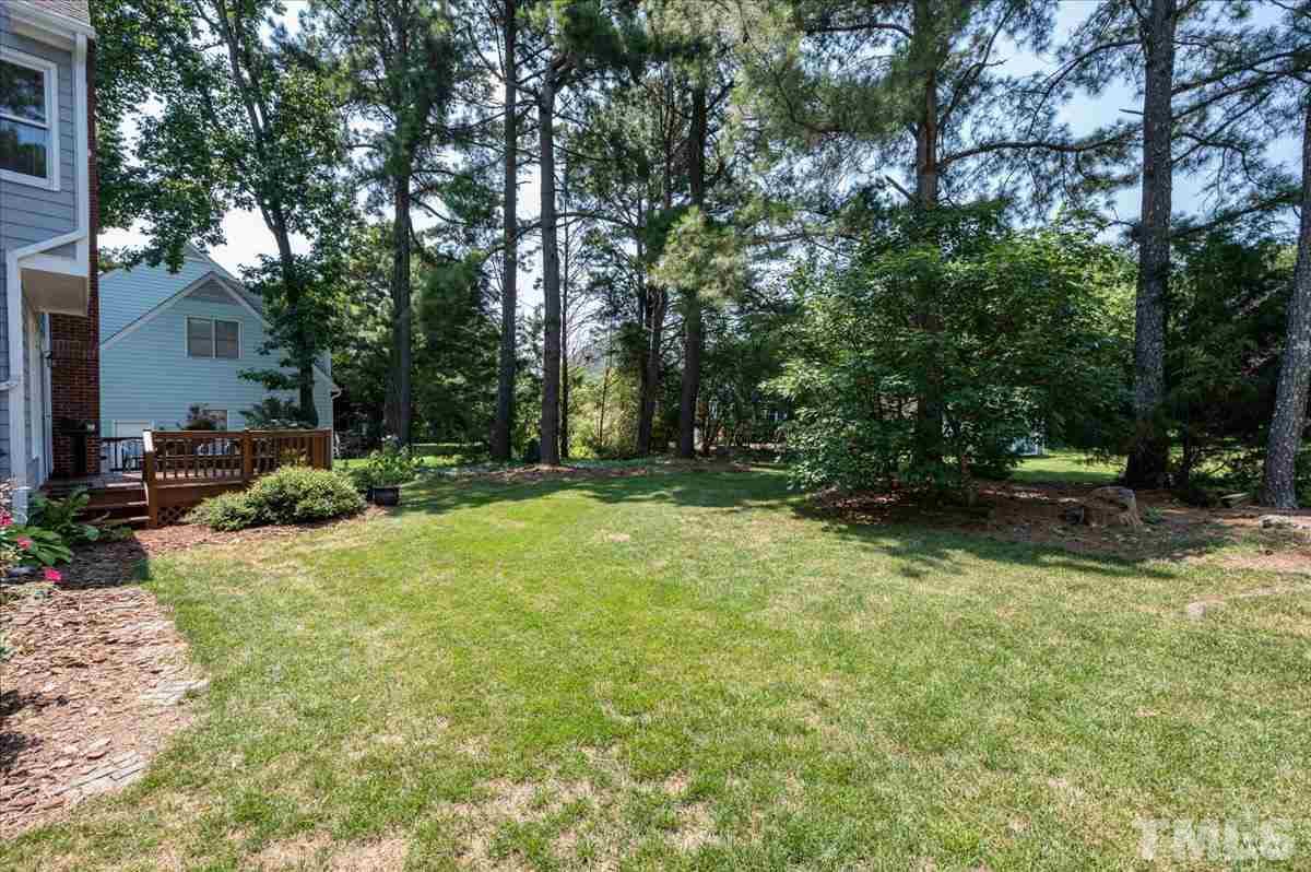 8813 Cottingham Way Raleigh, NC 27615 - Photo 23 of 27 a view of backyard with green space