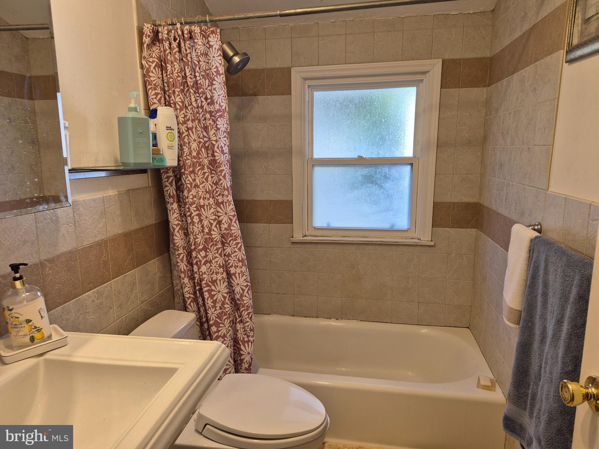 12512 Ofallon Street Silver Spring, MD 20904 - Photo 18 of 44 a bathroom with a sink a toilet and a bathtub