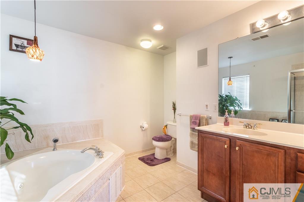 4 Seneca Lane Bordentown, NJ 08505 - Photo 15 of 29 a bathroom with a sink a toilet and tub
