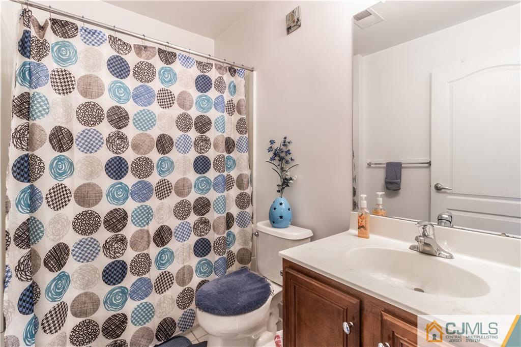 4 Seneca Lane Bordentown, NJ 08505 - Photo 18 of 29 a bathroom with a sink toilet and a mirror