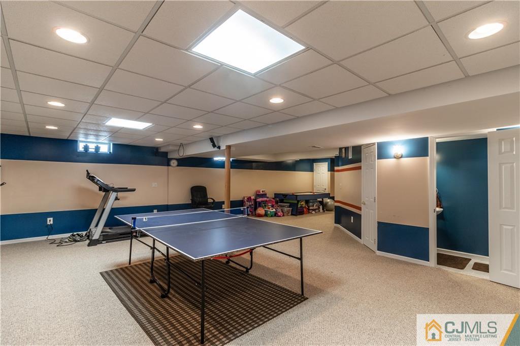 4 Seneca Lane Bordentown, NJ 08505 - Photo 23 of 29 a room with furniture and a table with wooden floor