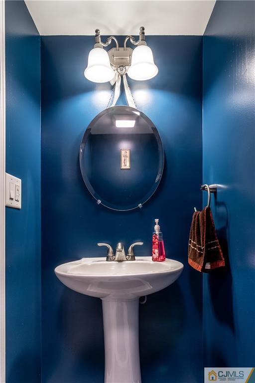 4 Seneca Lane Bordentown, NJ 08505 - Photo 25 of 29 a bathroom with a sink and a mirror