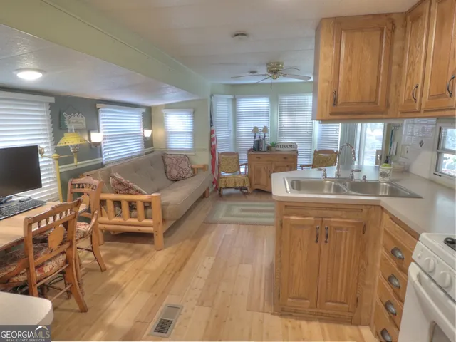 a view of hallway with wooden floor