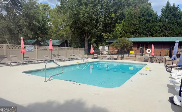 a view of a patio with a dining table and chairs