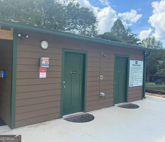 a view of a patio with a table and chairs