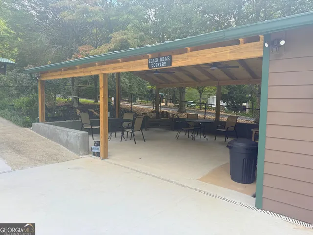 a view of a swimming pool with chair and table