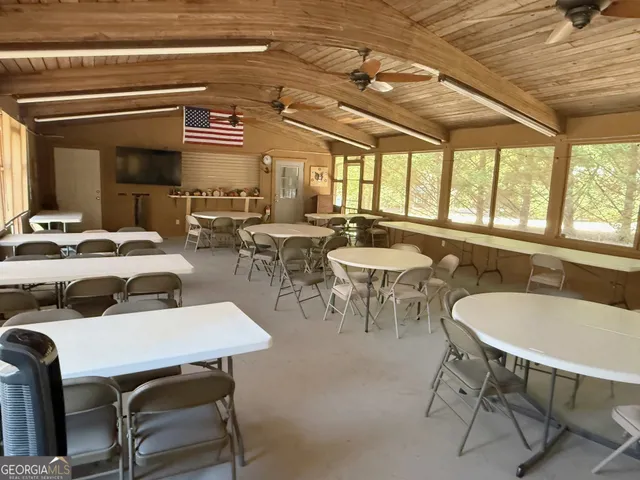a view of a wooden house with a yard