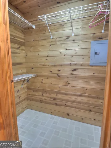 a bedroom with bed and a chandelier